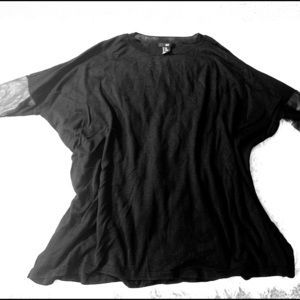 Black tunic with faux leather sleeves.